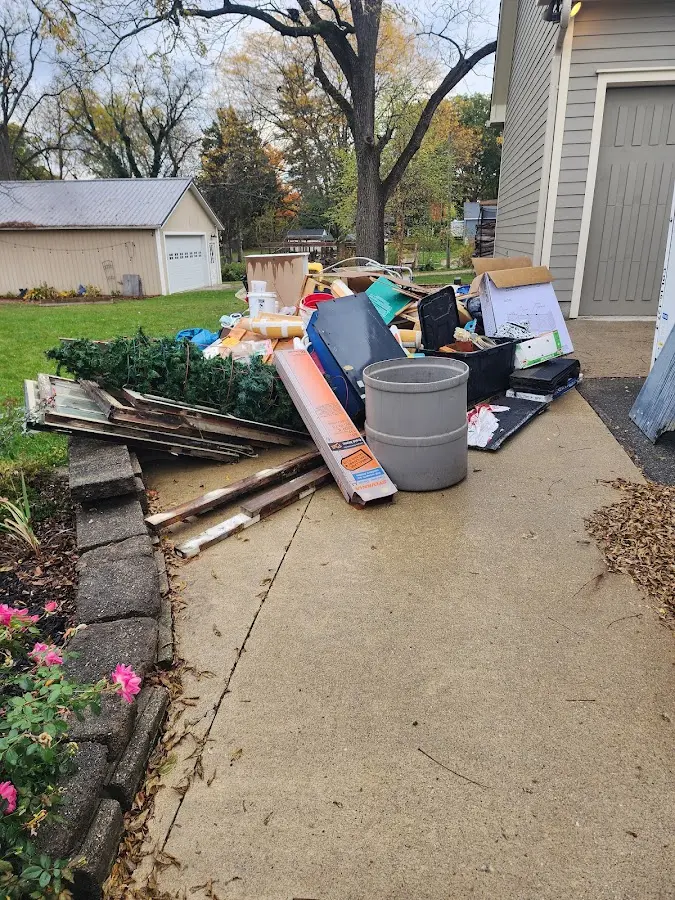 Dumpster being loaded with debris for Commercial Dumpster Rental in Town 'n' Country